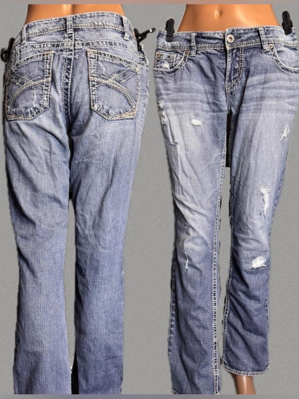 Silver blue jeans with white stitching and distressing